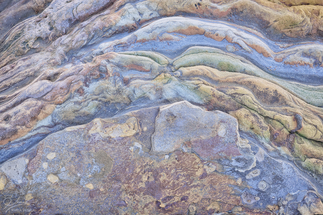 Sea Treasures | A corner of a stone showing different layers of color