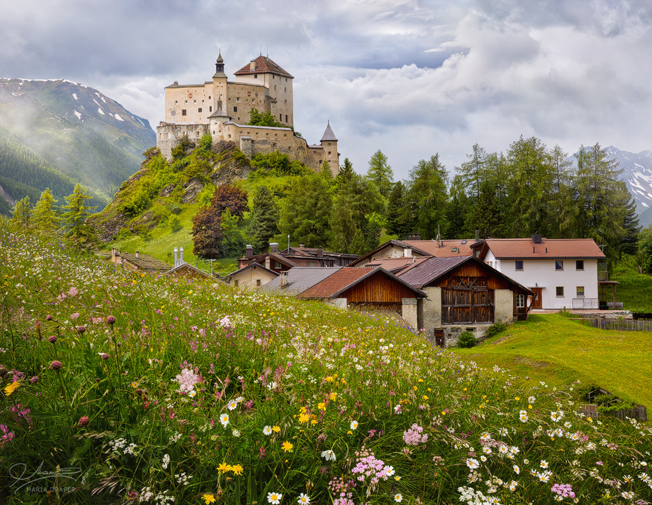 Tarasp Castle | This castle in Switzerland is among my most favorite castles because of the beautiful, fairytale like surroundings and tons of flowers and greenery in the Summer, and little Sparsels village at the base.