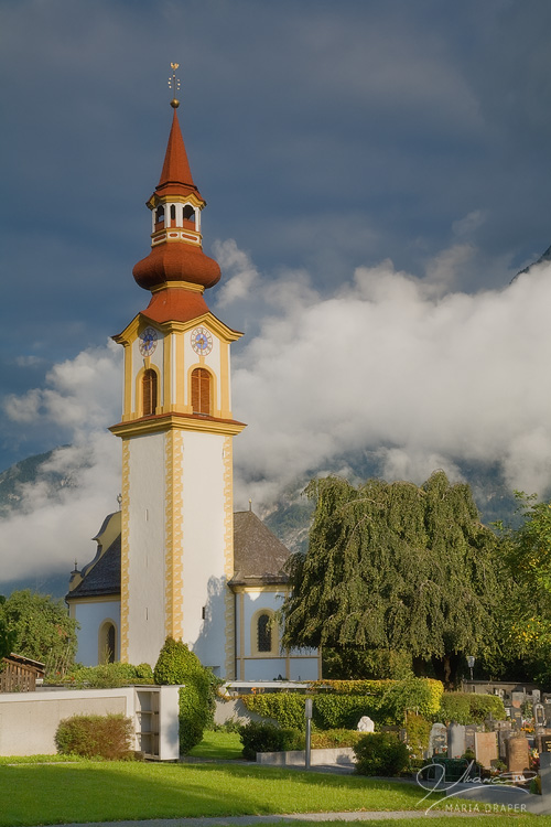 Vols, Austria | Village church and cemetery in the morning light