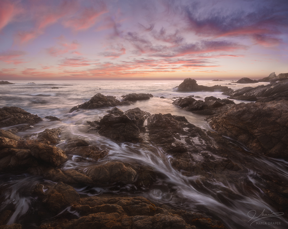 Garrapata Sunset  | Incoming waves captured in a slow speed moving through the rocks of the rugged coast of Garrapata State Park, under a pastel sunset.