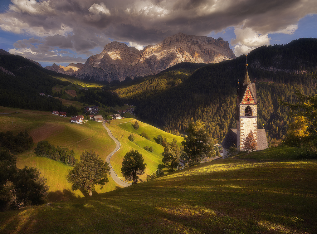 La Valle | Santa Barbara church in the village of La Valle, in Alta Badia, Italy.
<br>
This was an absolutely gorgeous late afternoon in this famous, yet secluded, village near Alta Badia.  The entire day was beautiful, with fast moving clouds and amazing light coming down through the clouds.  I've been planning  a visit to this area for years, but never got to it.  
</br>
In 2017 I finally made it here and have visited the place several days in a row.  
</br>
I lodged not far from here for 4 days, and each day I made a visit, or two to this little village besides visiting other places in this beautiful area in the Dolomites.  
</br>
Over the multiple visits here, I've captured many different moods and atmosphere, from several different angles.
This is one of my most favorite captures of this beautiful church over the four days spent around it, but I have many more coming up that are equally good, so keep checking my 