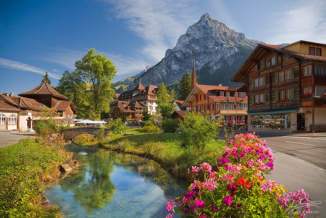 Kandersteg | Center of city Kandersteg on a beautiful morning, taken from a small bridge over the Kander River.  Visible here is the Dundenhorn Peak nicely illuminated by the morning light.
</br>
Image featured on Castorland Puzzles